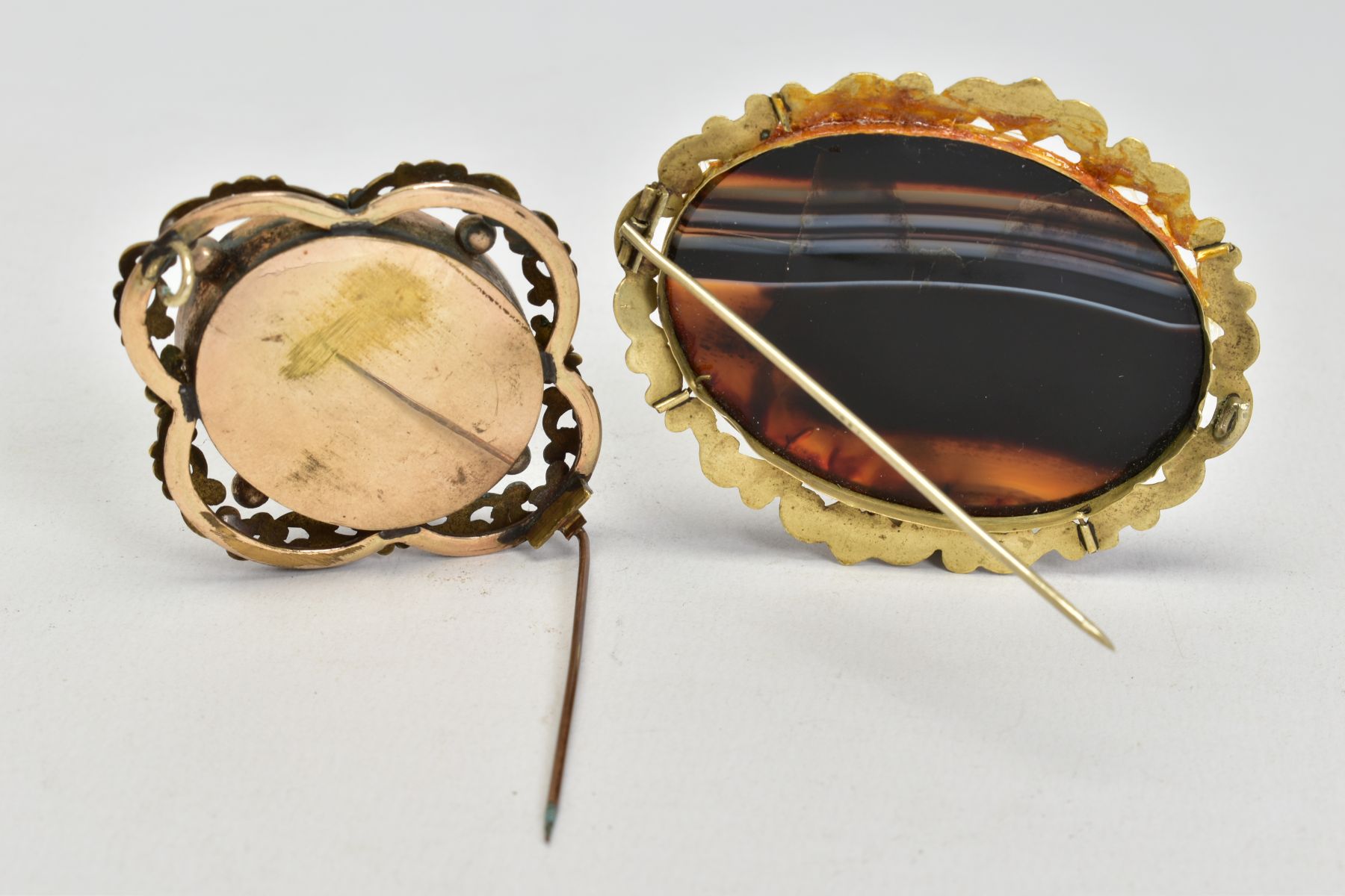 TWO VICTORIAN BROOCHES, to include a yellow metal mourning brooch, featuring an oval glass panel, - Image 2 of 3