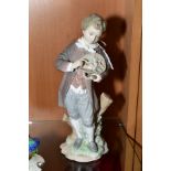 A LLADRO FIGURE, depicting a boy with an upturned hat containing flowers by a tree stump, height