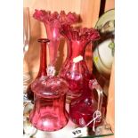 FIVE PIECES OF VICTORIAN AND LATER CRANBERRY AND RUBY GLASS including a jar and cover, a dimpled