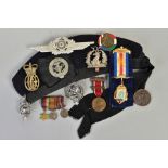 A BOX CONTAINING A BLACK COLOURED BOYS BRIDAGE SIDE CAP, with original badge, a metal cockade for