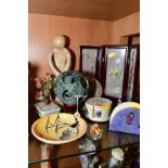 A NEPHRITE PUZZLE BALL, diameter 12cm, with a wooden stand together with a soapstone figure group,