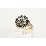 A 9CT GOLD SAPPHIRE AND DIAMOND CLUSTER RING, the tiered cluster set with circular cut sapphires and