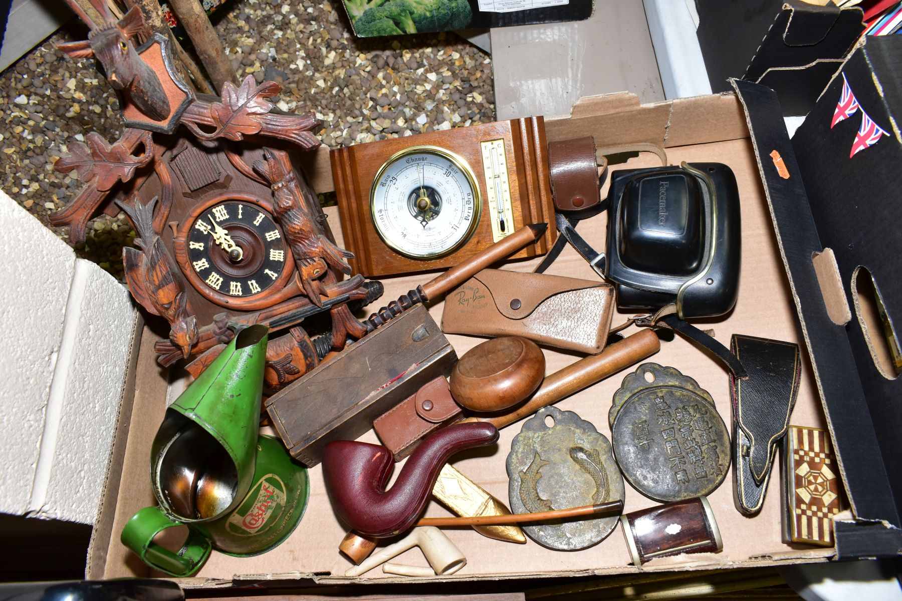 A BOX OF SUNDRY ITEMS to include an early 20th Century cuckoo clock, a leather cased smokers pipe