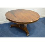 A VICTORIAN ROSEWOOD CIRCULAR TILT TOP BREAKFAST TABLE, on a cylindrical tapering support, concave