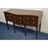 A GEORGIAN MAHOGANY AND EDGE BANDED SERPENTINE SIDEBOARD with a double cupboard doors and two