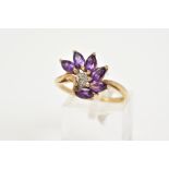 A 9CT GOLD AMETHYST AND DIAMOND RING, designed with an asymmetrical row of marquise cut amethyst