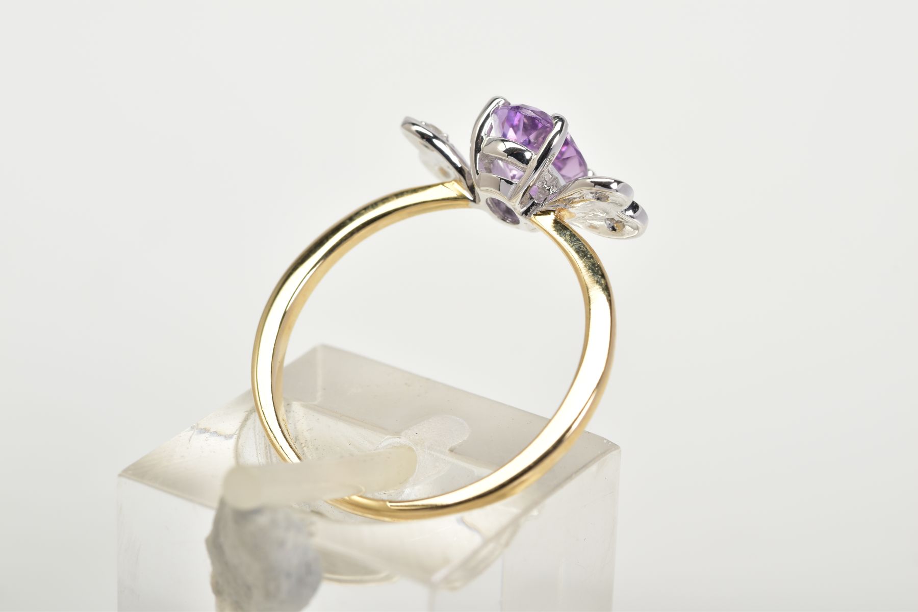 A 9CT GOLD AMETHYST AND DIAMOND RING, set with a central oval cut amethyst flanked with single cut - Image 3 of 3