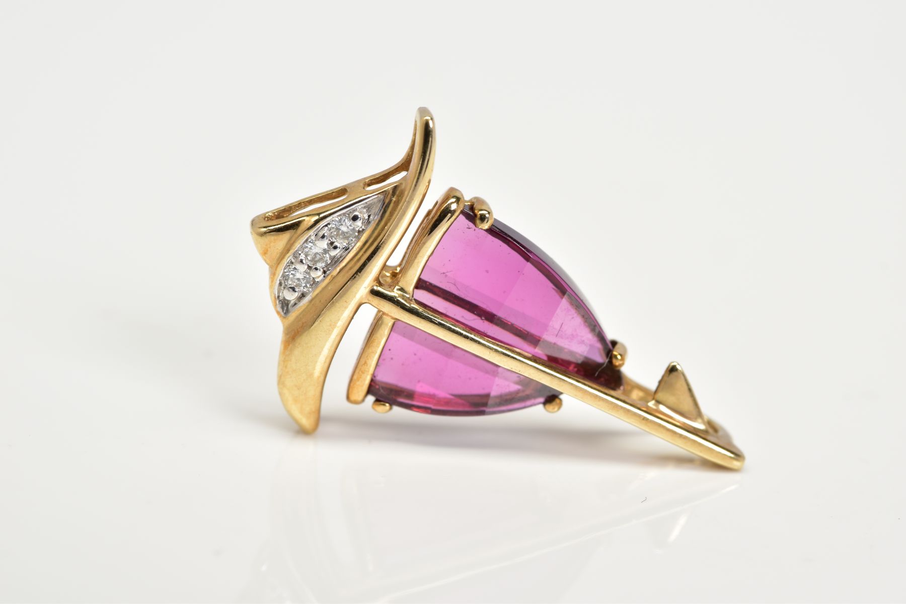 AN AMETHYST AND DIAMOND PENDANT, the yellow metal pendant in the form of a yacht, set with garnet