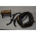 A VINTAGE HORSE COLLAR with metal bolts, together with a pair of horse hames and a carved oak