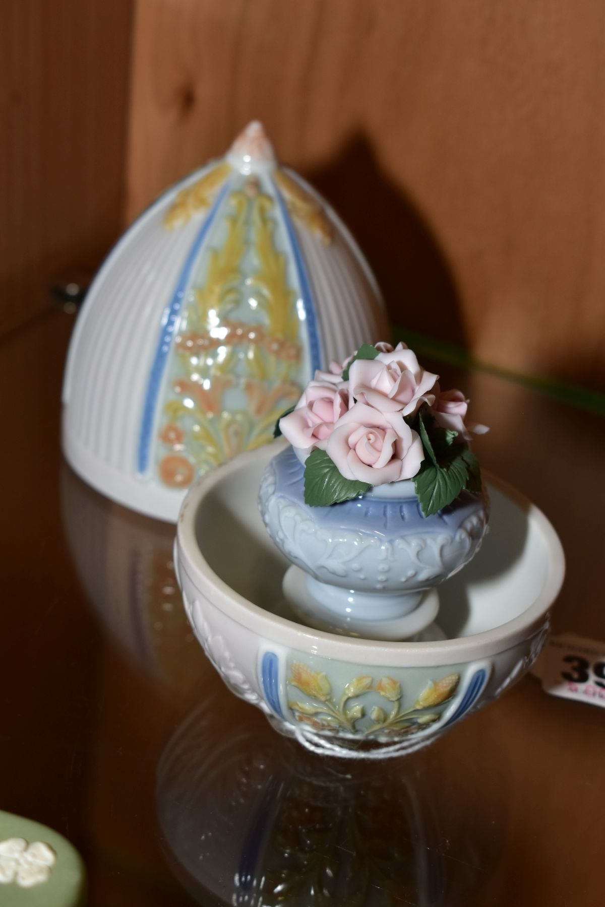 A LLADRO PORCELAIN 'SUMMER EGG' No 6293, containing a vase of roses, total height 13cm