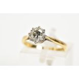 A SINGLE STONE DIAMOND RING, the yellow metal ring set with a single round brilliant cut diamond,