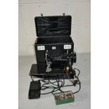 A VINTAGE SINGER 221K FEATHERWEIGHT SEWING MACHINE with original case, Treadle and power cable, a