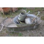 A COLLECTION OF VINTAGE GALVANISED ITEMS including a twin handled bath, length 137cm, three small