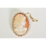 A 9CT GOLD CAMEO BROOCH, the oval cameo depicting a lady in profile, within a collet mount and