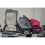 SEVEN MODERN SUITCASES including a silver set of three, a black set of two, a small pink and