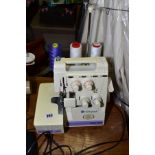 A VIKING HUSQUVARNE HUSKYLOCK MODEL 360D OVERLOCK MACHINE with pedal and power cable (PAT pass and