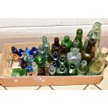 A BOX OF MOSTLY VINTAGE GLASS BOTTLES AND TWO SMALL STONEWARE JARS/INK POT, various coloured glass