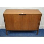 A MID 20TH CENTURY TEAK DOUBLE BI FOLD DOOR SHOE CABINET, with brassed poles, width 107cm x 37cm x