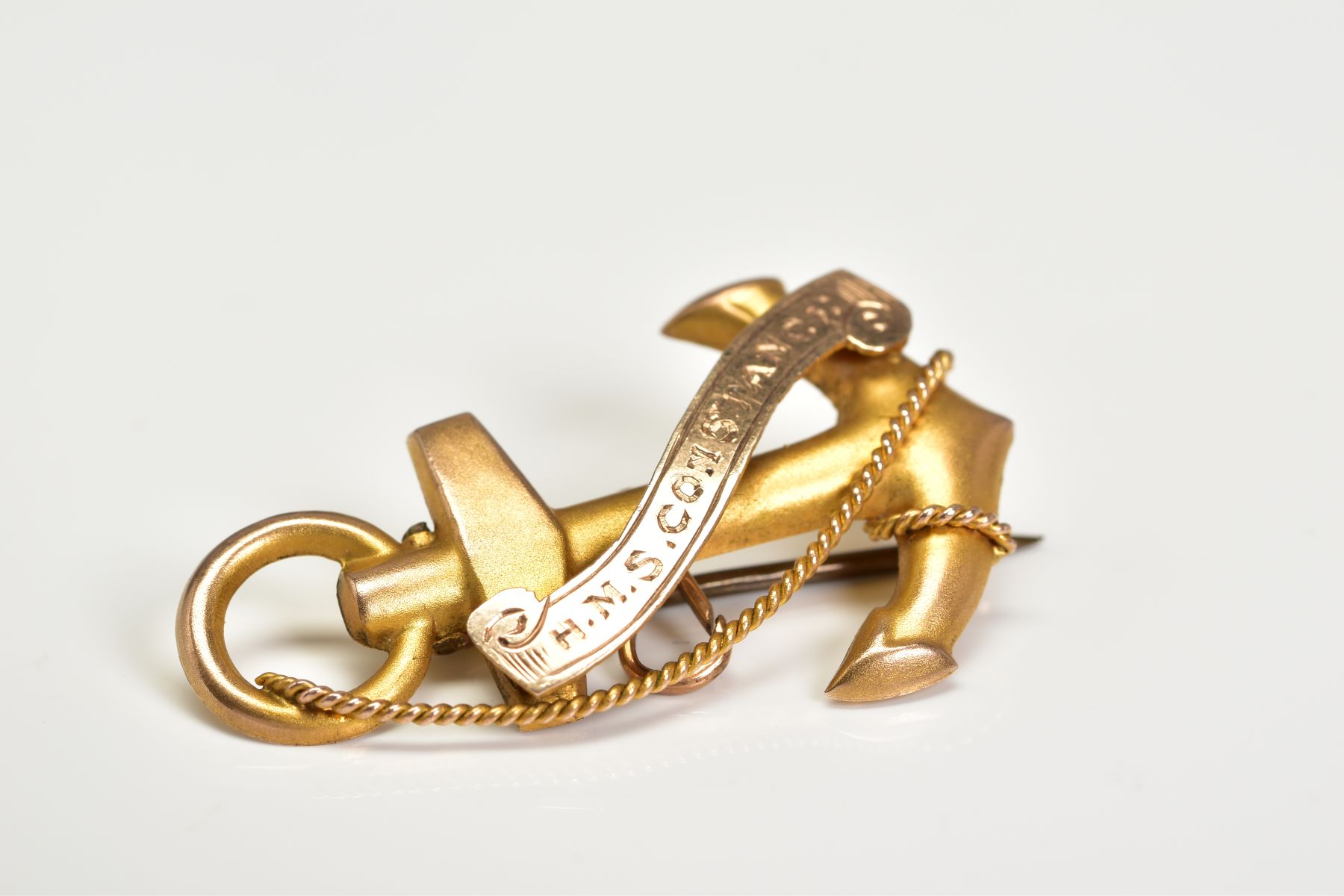 A YELLOW METAL VICTORIAN BROOCH, in the form of an anchor and rope with engraved scroll 'H.M.S. - Image 2 of 3