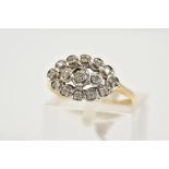 A 9CT GOLD DIAMOND CLUSTER RING, designed as an openwork lozenge shape set with fifteen single cut