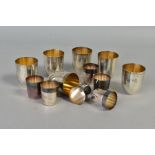 A SET OF SIX 20TH CENTURY STERLING SILVER TOTS, plain with gilt interiors, stamped to bases '935