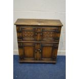 A REPRODUCTION OAK PANELLED FOUR DOOR CABINET, width 84cm x depth 32cm x height 92cm (sd to top)