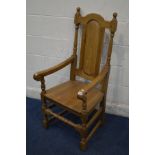 A REPRODUCTION GOLDEN OAK OPEN ARMCHAIR