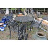 A MODERN CAST ALUMINIUM GARDEN TABLE with pierced top, diameter 125cm x height 75cm along with