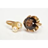 TWO YELLOW METAL GEM SET RINGS, the first a large claw set smokey quartz within an openwork