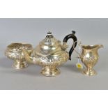 AN EDWARDIAN SILVER THREE PIECE BACHELOR'S TEASET, comprising circular teapot and sugar bowl and a