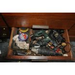 THE CONTENTS OF A DRAWER FULL OF POWER TOOLS, including a Bosch electric drill, a Black and Decker