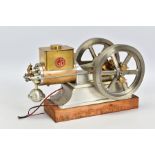 A HANDBUILT MODEL HORIZONTAL SINGLE CYLINDER STATIONARY ENGINE, powering twin flywheels (diameter