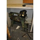 A WARCO 4 1/2'' METAL CUTTING BAND SAW, on stand with a homemade roller stand (2)