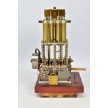A HANDBUILT MODEL VERTICAL TWIN CYLINDER MARINE ENGINE, not tested, spirit or gas fired, fitted