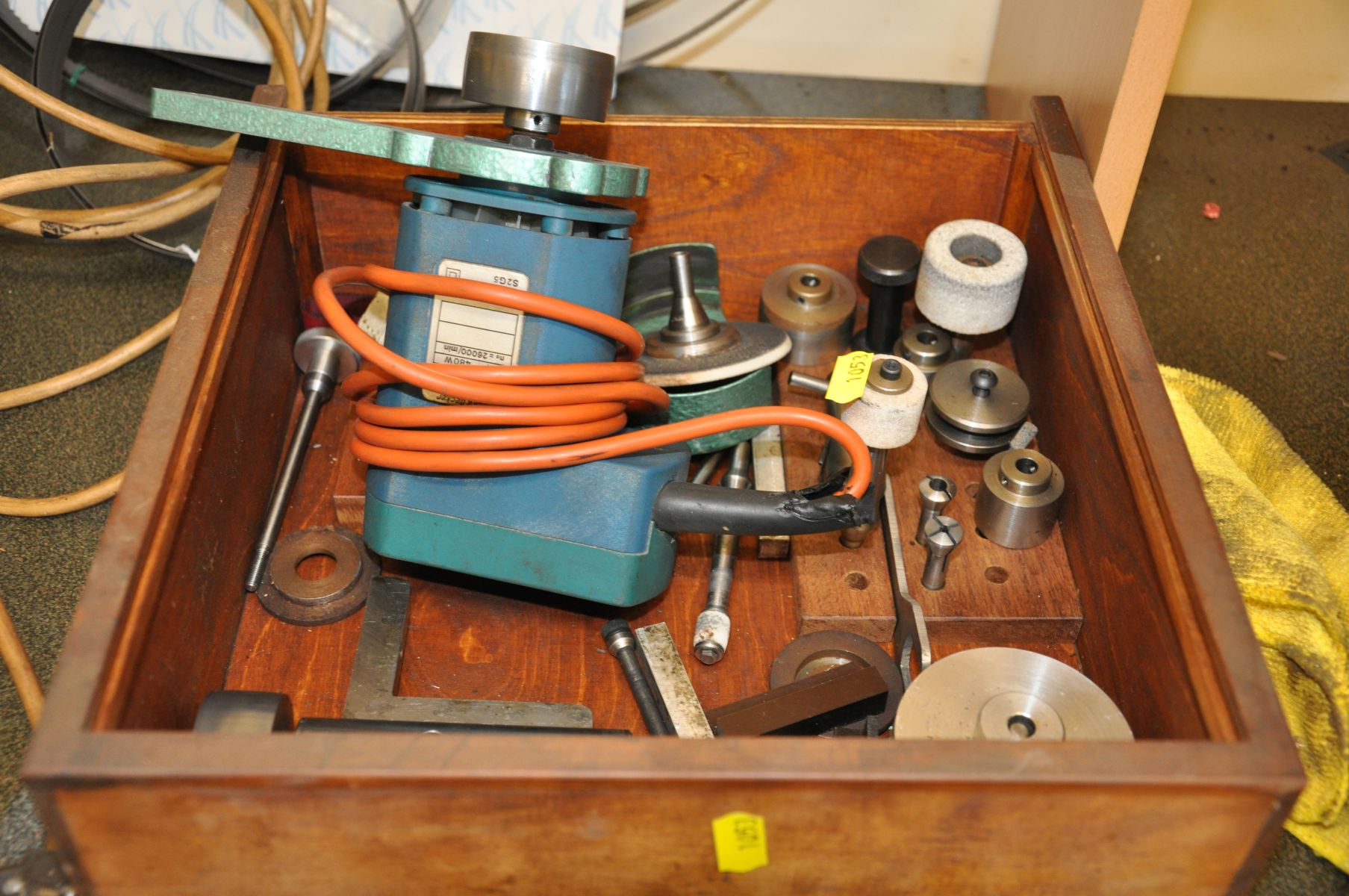 A TRAY WITH A VINTAGE BLACK AND DECKER ROUTER, fitted with and accessories for it to be mounters