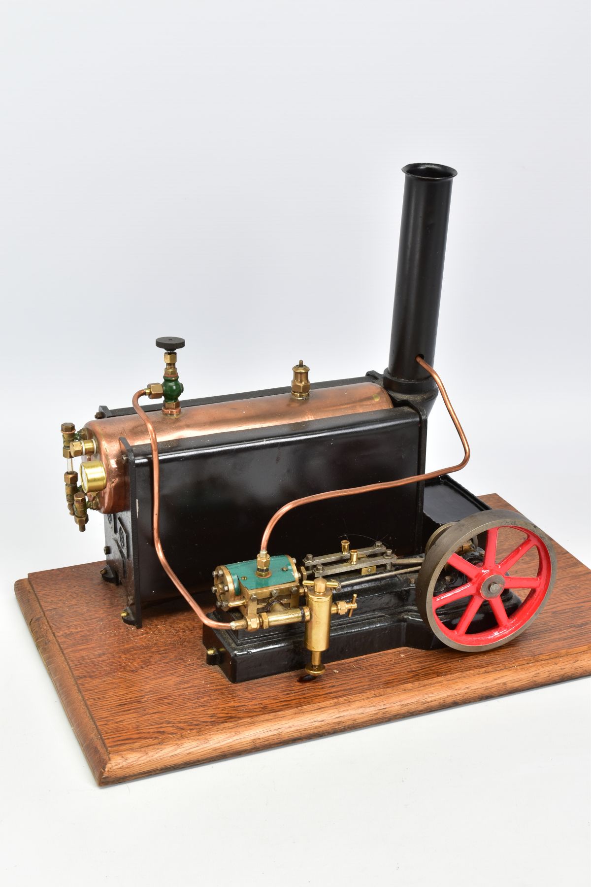 A STUART TURNER LIVE STEAM ENGINE, not tested, horizontal copper boiler powering a single cylinder