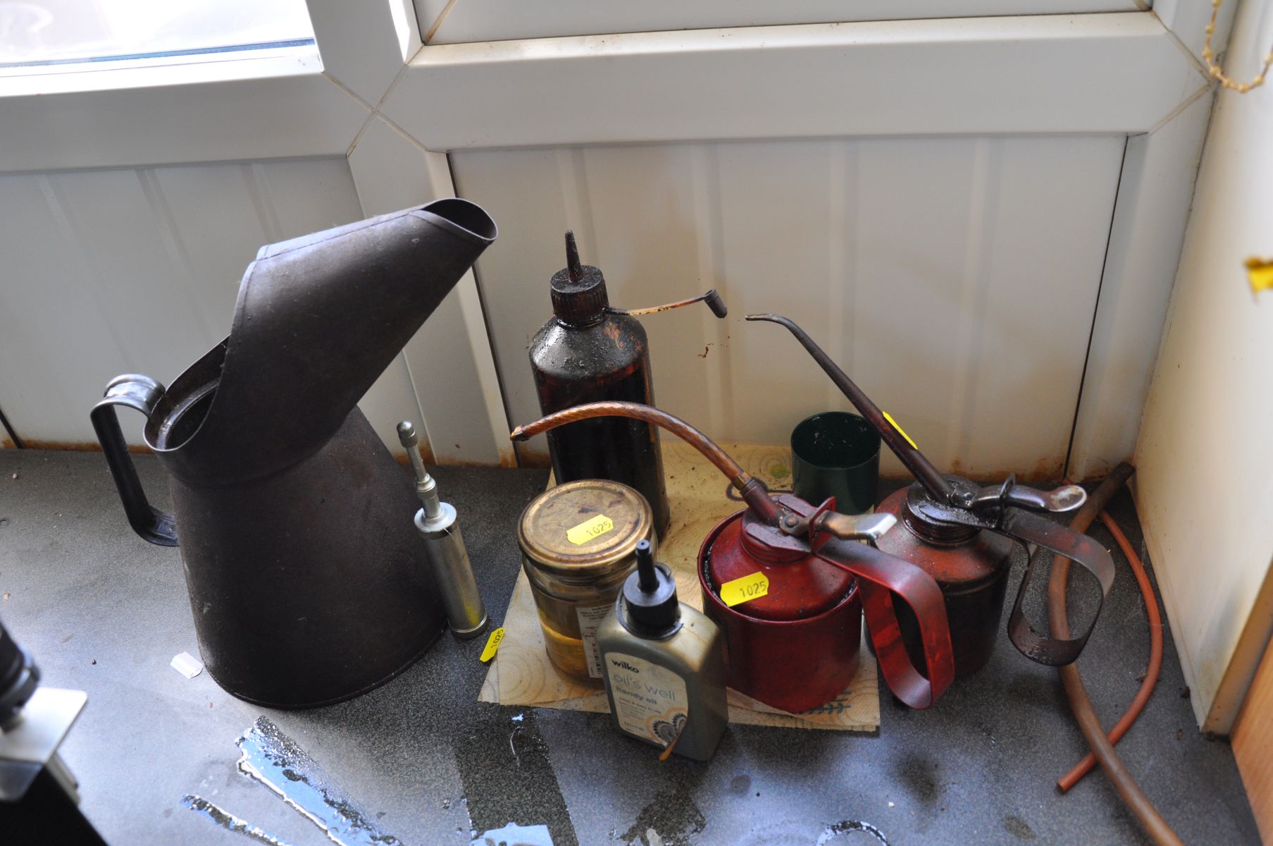 THREE VINTAGE OIL CAN AND A SMALL GREASE GUN, along with other oils