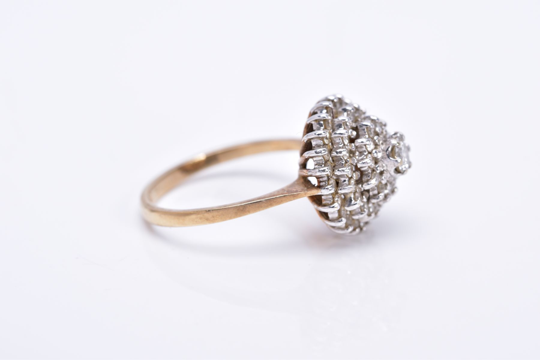 A 9CT GOLD DIAMOND CLUSTER RING, the tiered cluster with a central round brilliant cut diamond and - Image 2 of 3