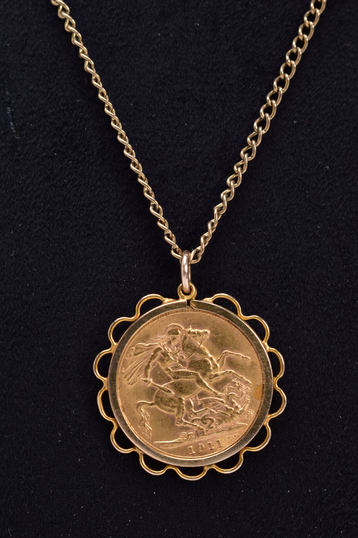 A FULL SOVEREIGN PENDANT, George V dated 1911 in a later pendant mount tested as 9ct gold,