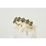 A 9CT GOLD EMERALD AND DIAMOND HALF HOOP RING, designed with claw set single cut diamonds within a