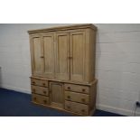 A VICTORIAN PINE HOUSE KEEPERS CUPBOARD, with a fixed cornice, four panelled doors concealing