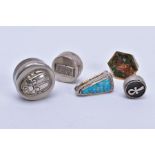 FIVE ASSORTED WHITE METAL PILL BOXES, various sizes and designs to include a coloured enamel, a