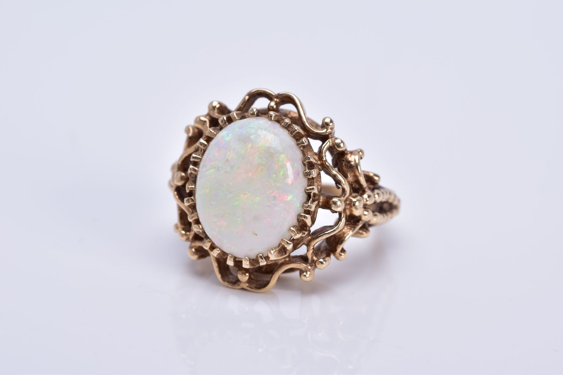 A LATE 20TH CENTURY 9CT GOLD OPAL SINGLE STONE RING, opal measuring approximately 14.5mm x 11.5mm,