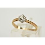 A 9CT GOLD DIAMOND CLUSTER RING, designed with a small cluster set with seven round brilliant cut