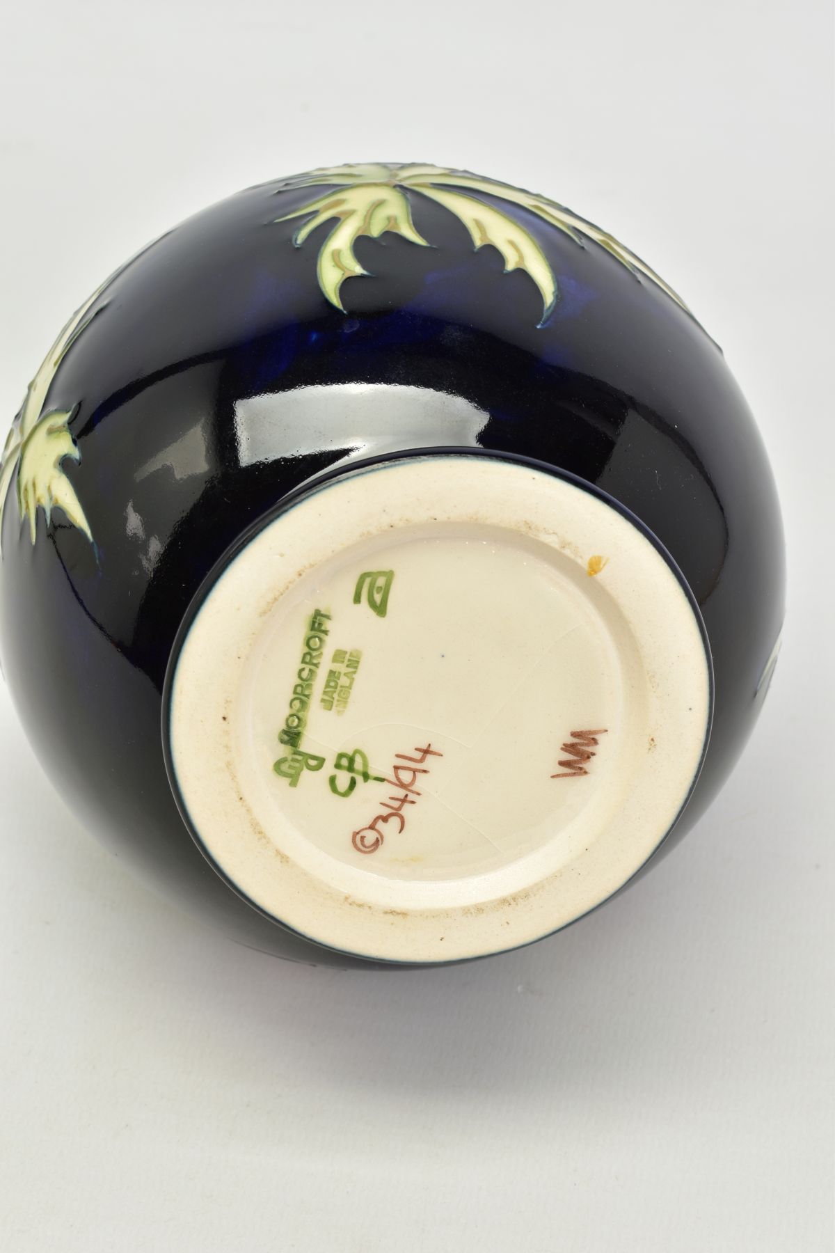 A MOORCROFT POTTERY VASE, 'Anemone' pattern on dark blue ground, impressed backstamp, No 34/94 - Image 4 of 4