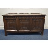 A GEORGIAN OAK COFFER, with a lunette frieze above three carved geometric panels and single side