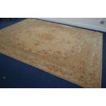 A LARGE MODERN ABBEY FOLIATE GOLD GROUND CARPET SQUARE, 366cm x 274cm