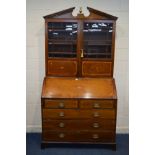 A GEORGIAN MAHOGANY, SATINWOOD STRUNG AND SHELL INLAID BUREAU BOOKCASE, the later swan