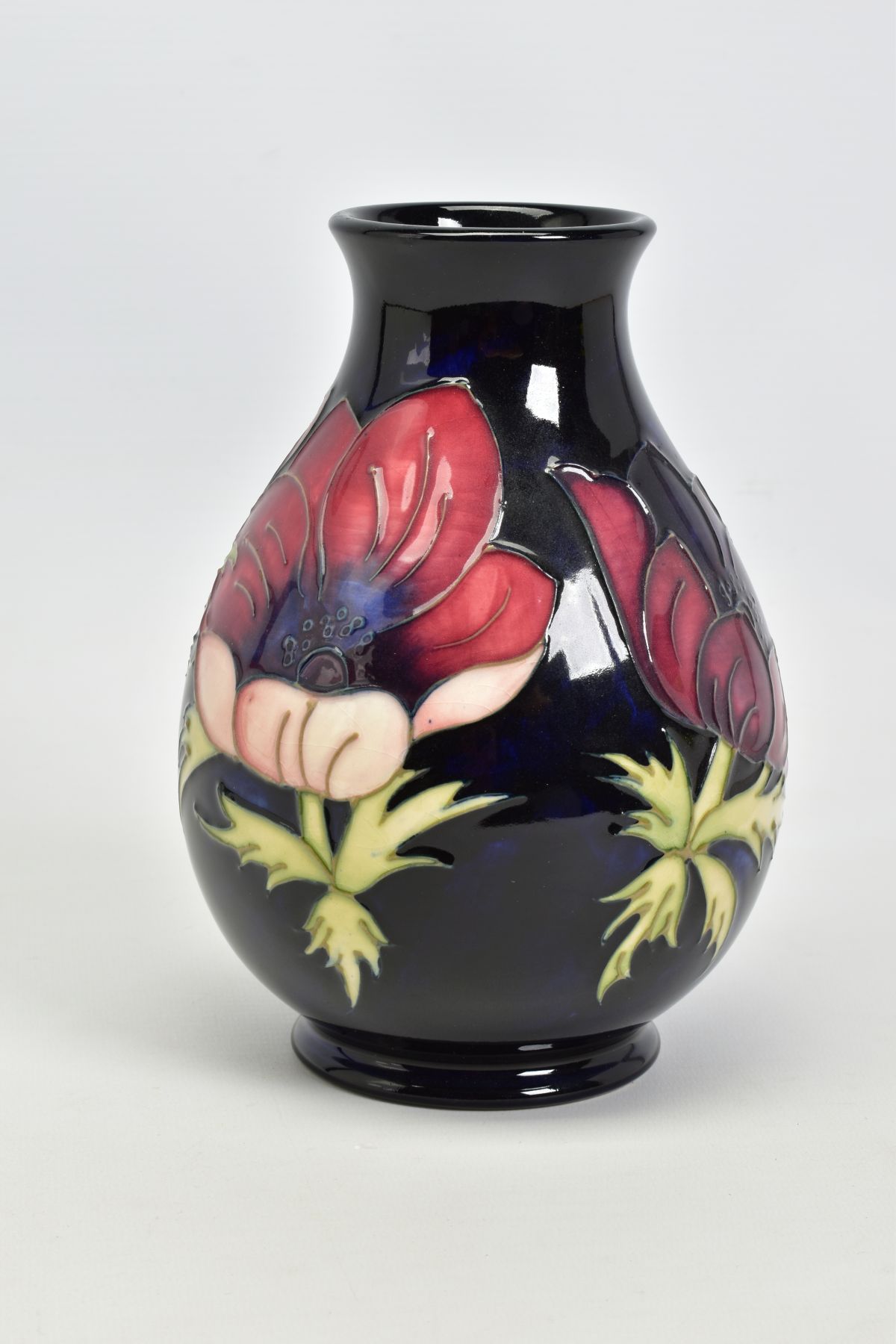 A MOORCROFT POTTERY VASE, 'Anemone' pattern on dark blue ground, impressed backstamp, No 34/94 - Image 3 of 4