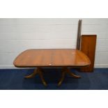 A REPRODUX YEWWOOD TWIN PEDESTAL DINING TABLE, with two additional leaves, extended length 176cm x